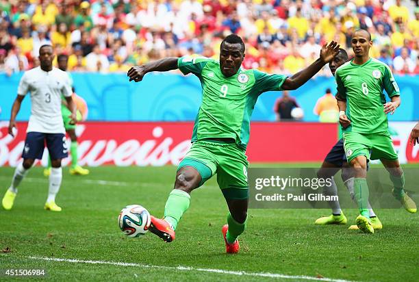 Emmanuel Emenike of Nigeria scores but the goal is disallowed during the 2014 FIFA World Cup Brazil Round of 16 match between France and Nigeria at...