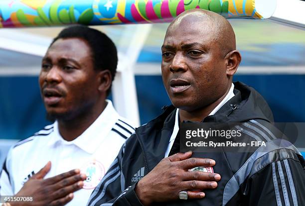 Head coach Stephen Keshi of Nigeria lines up for the national anthem prior to the 2014 FIFA World Cup Brazil Round of 16 match between France and...
