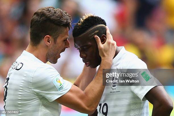 Olivier Giroud and Paul Pogba of France react after a missed chance during the 2014 FIFA World Cup Brazil Round of 16 match between France and...