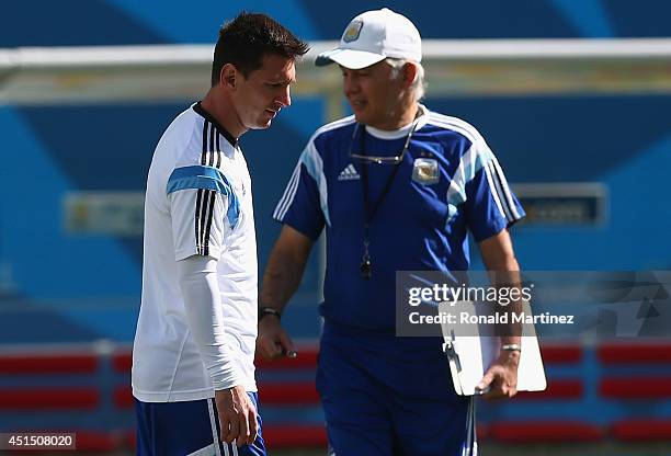 Lionel Messi of Argentina and coach Alejandro Sabella during a training session at Arena de Sao Paulo on June 30, 2014 in Sao Paulo, Brazil.