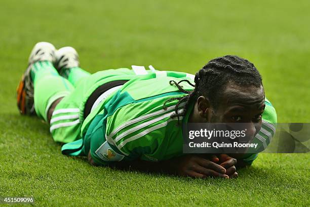 Victor Moses of Nigeria lies on the ground after a challenge during the 2014 FIFA World Cup Brazil Round of 16 match between France and Nigeria at...