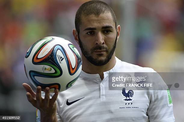 France's forward Karim Benzema holds the ball during the round of 16 football match between France and Nigeria at the Mane Garrincha National Stadium...
