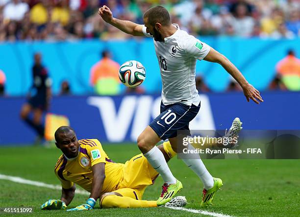 Karim Benzema of France and Vincent Enyeama of Nigeria compete for the ball during the 2014 FIFA World Cup Brazil Round of 16 match between France...