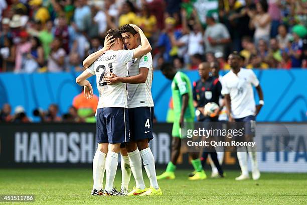 Laurent Koscielny and Raphael Varane of France celebrate after defeating Nigeria 2-0 during the 2014 FIFA World Cup Brazil Round of 16 match between...