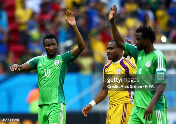 John Obi Mikel , Vincent Enyeama and Efe Ambrose of Nigeria acknowledge the supporters after the 0-2 defeat in the 2014 FIFA World Cup Brazil Round...