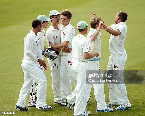 Alasdair Pollock of Cambridge celebrates with team mates after taking a wicket during the Varsity one day match between Oxford University and...