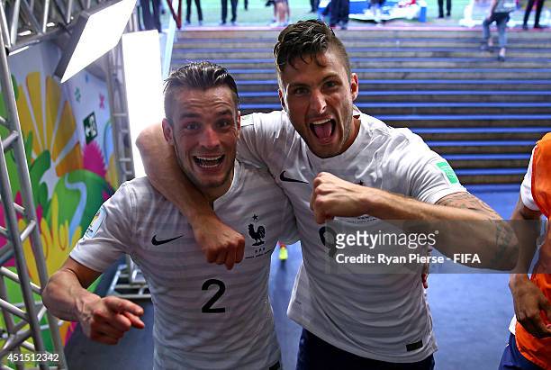 Mathieu Debuchy and Olivier Giroud of France celebrate the 2-0 win in the tunnel after the 2014 FIFA World Cup Brazil Round of 16 match between...
