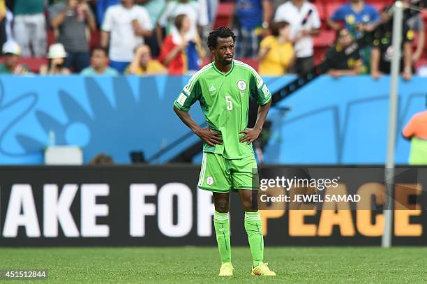 Nigeria's defender Efe Ambrose reacts during the round of 16 football match between France and Nigeria at the Mane Garrincha National Stadium in...