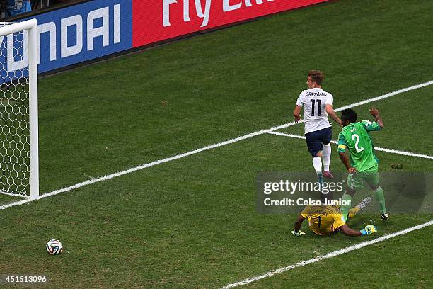 Joseph Yobo of Nigeria scores an own goal as goalkeeper Vincent Enyeama and Antoine Griezmann of France look on during the 2014 FIFA World Cup Brazil...