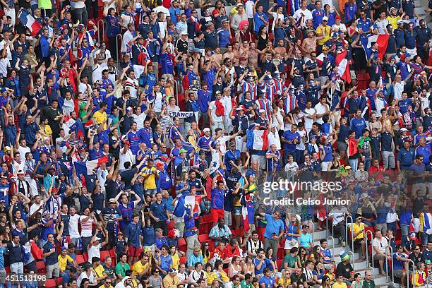 Fans cheer during the 2014 FIFA World Cup Brazil Round of 16 match between France and Nigeria at Estadio Nacional on June 30, 2014 in Brasilia,...