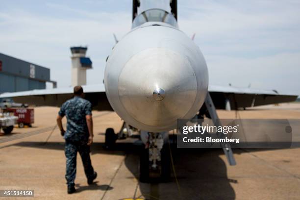 Navy F/A-18C aircraft sits on the flight line at the Naval Air Station Oceana in Virginia Beach, U.S., on Thursday, June 19, 2014. NAS Oceana is the...