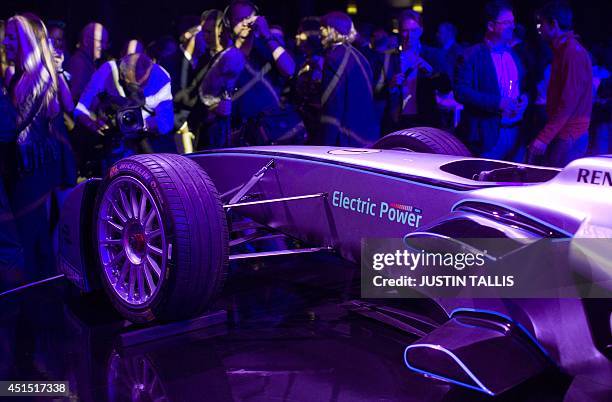 Racing car is pictured on a stand at the Global Launch of the all-electric FIA Formula E Championship in London on June 30, 2014. AFP PHOTO/JUSTIN...