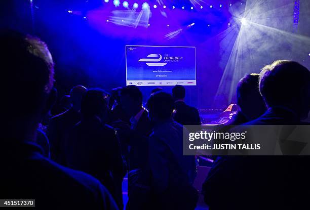 People gather at the Global Launch of the all-electric FIA Formula E Championship in London on June 30, 2014. AFP PHOTO/JUSTIN TALLIS