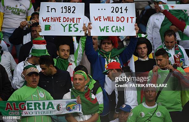 Algeria's fans cheer before a Round of 16 football match between Germany and Algeria at Beira-Rio Stadium in Porto Alegre during the 2014 FIFA World...