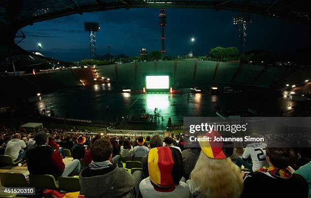 German fans react to play watching the FIFA World Cup 2014 Round of 16 match between Germany and Algeria tense and troubled on a giant screen at the...