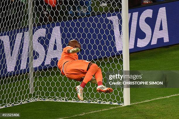 Algeria's goalkeeper Rais Mbohli makes a save during the Round of 16 football match between Germany and Algeria at Beira-Rio Stadium in Porto Alegre...