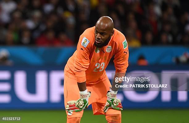 Algeria's goalkeeper Rais Mbohli reacts during a Round of 16 football match between Germany and Algeria at Beira-Rio Stadium in Porto Alegre during...