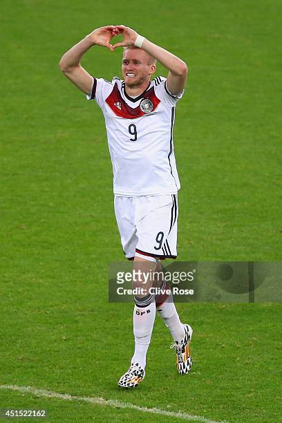 Andre Schuerrle of Germany celebrates scoring his team's first goal during the 2014 FIFA World Cup Brazil Round of 16 match between Germany and...