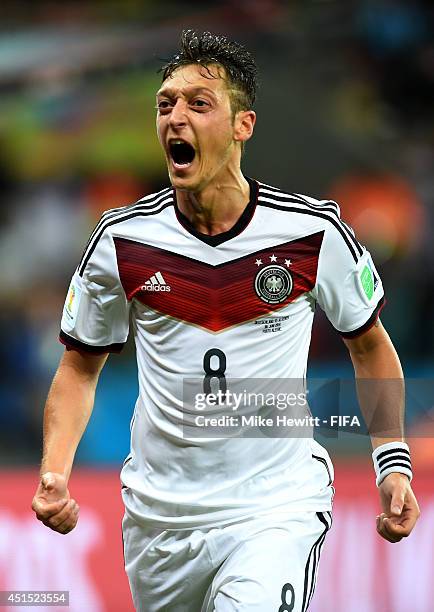 Mesut Oezil of Germany celebrates scoring his team's second goal during the 2014 FIFA World Cup Brazil Round of 16 match between Germany and Algeria...