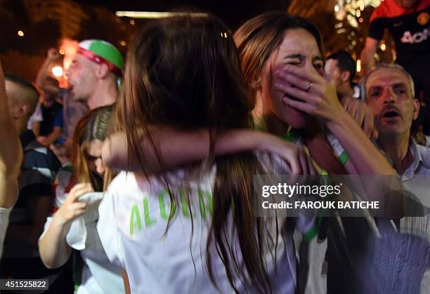 Fans of Alergia react during a public screening June 30, 2014 in Algiers of Algeria's 2014 FIFA World Cup match against Germany in Brazil. Extra-time...