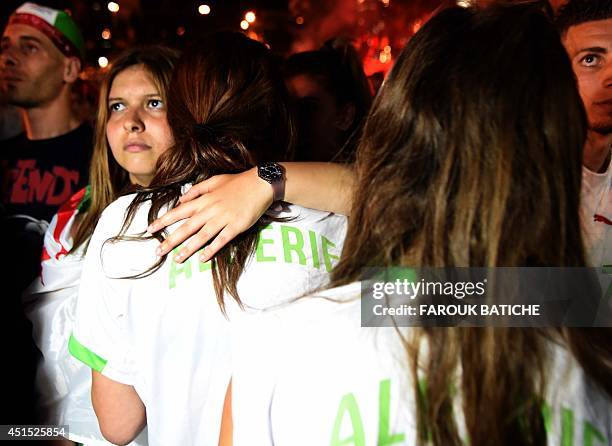 Disappointed fans of Alergia react during a public screening June 30, 2014 in Algiers of Algeria's 2014 FIFA World Cup match against Germany in...