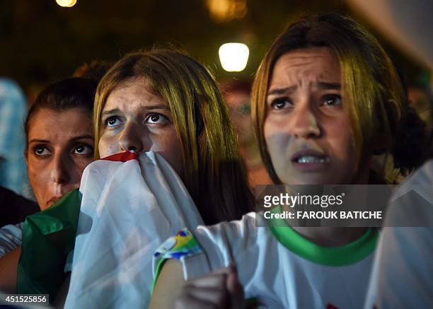 Disappointed fans of Alergia react during a public screening June 30, 2014 in Algiers of Algeria's 2014 FIFA World Cup match against Germany in...
