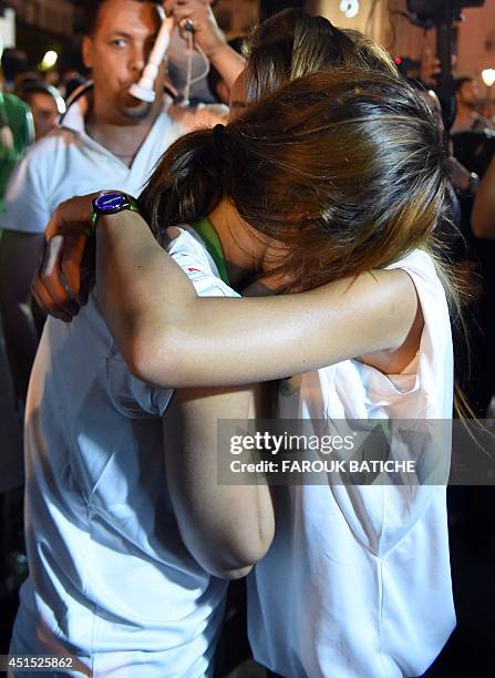 Disappointed fans of Alergia react during a public screening June 30, 2014 in Algiers of Algeria's 2014 FIFA World Cup match against Germany in...