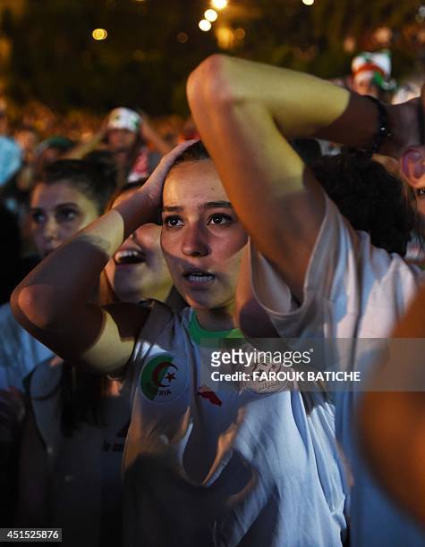 Fans of Alergia react during a public screening June 30, 2014 in Algiers of Algeria's 2014 FIFA World Cup match against Germany in Brazil. Extra-time...
