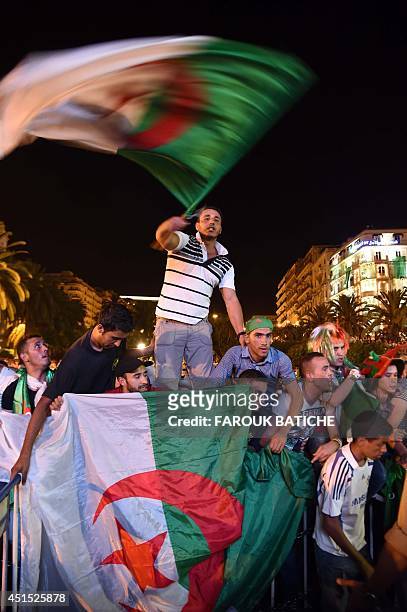 Fans of Alergia react during a public screening June 30, 2014 in Algiers of Algeria's 2014 FIFA World Cup match against Germany in Brazil. Extra-time...