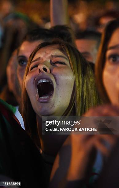 Fans of Alergia react during a public screening June 30, 2014 in Algiers of Algeria's 2014 FIFA World Cup match against Germany in Brazil. Extra-time...