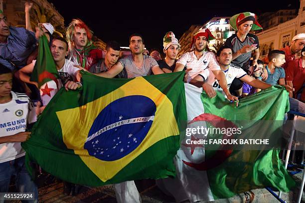 Fans of Alergia react during a public screening June 30, 2014 in Algiers of Algeria's 2014 FIFA World Cup match against Germany in Brazil. Extra-time...