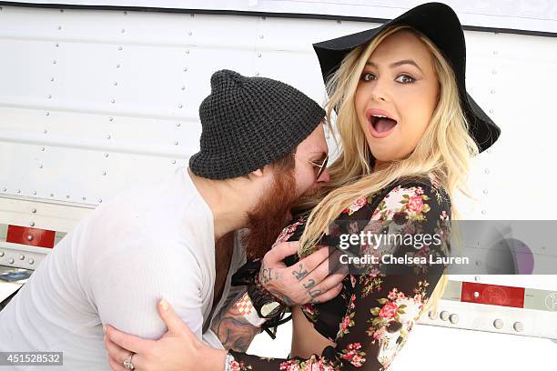 Vocalist Danny Worsnop of Asking Alexandria and model Markie McManus pose backstage during the Vans Warped Tour on June 22, 2014 in Ventura,...