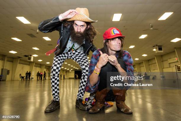 Andrew Schwartz and TV personality Jesse Camp pose backstage during the Vans Warped Tour on June 22, 2014 in Ventura, California.