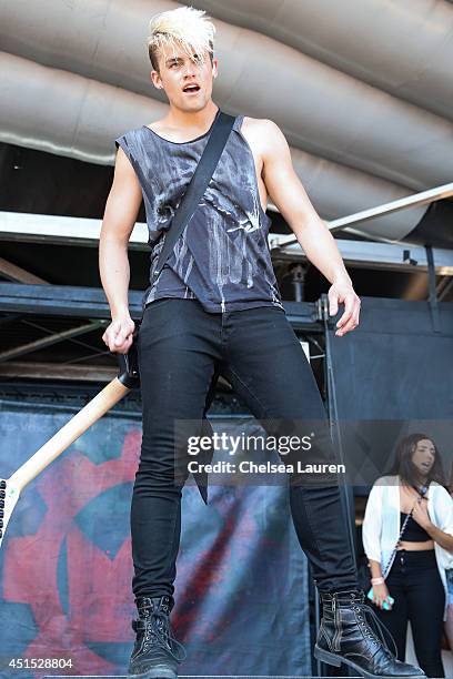 Guitarist Bennett "Benn Suede" Vogelman of Crown the Empire performs during the Vans Warped Tour on June 22, 2014 in Ventura, California.