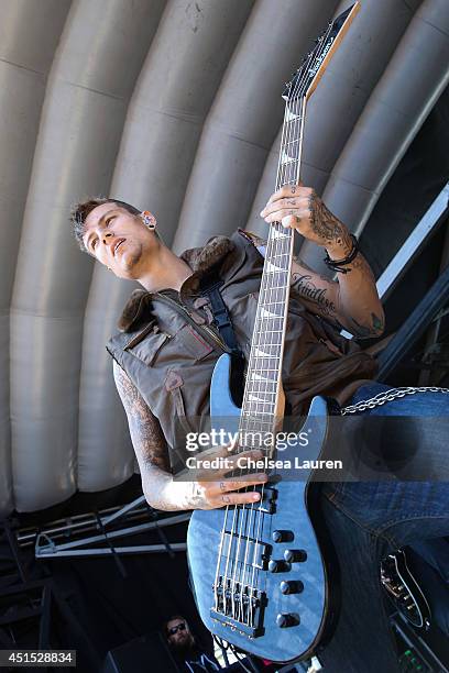 Bassist Hayden Tree of Crown the Empire performs during the Vans Warped Tour on June 22, 2014 in Ventura, California.