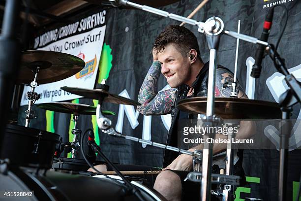 Drummer Brent Taddie of Crown the Empire performs during the Vans Warped Tour on June 22, 2014 in Ventura, California.