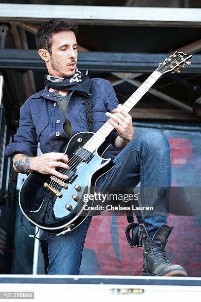 Guitarist Brandon Hoover of Crown the Empire performs during the Vans Warped Tour on June 22, 2014 in Ventura, California.