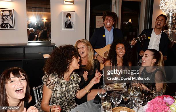 Annabelle Neilson, Jeanette Calliva, Rachel Hunter, Isabella Calliva and Amber Le Bon listen to Didier Casnati and The Gypsy Queens perform at The...