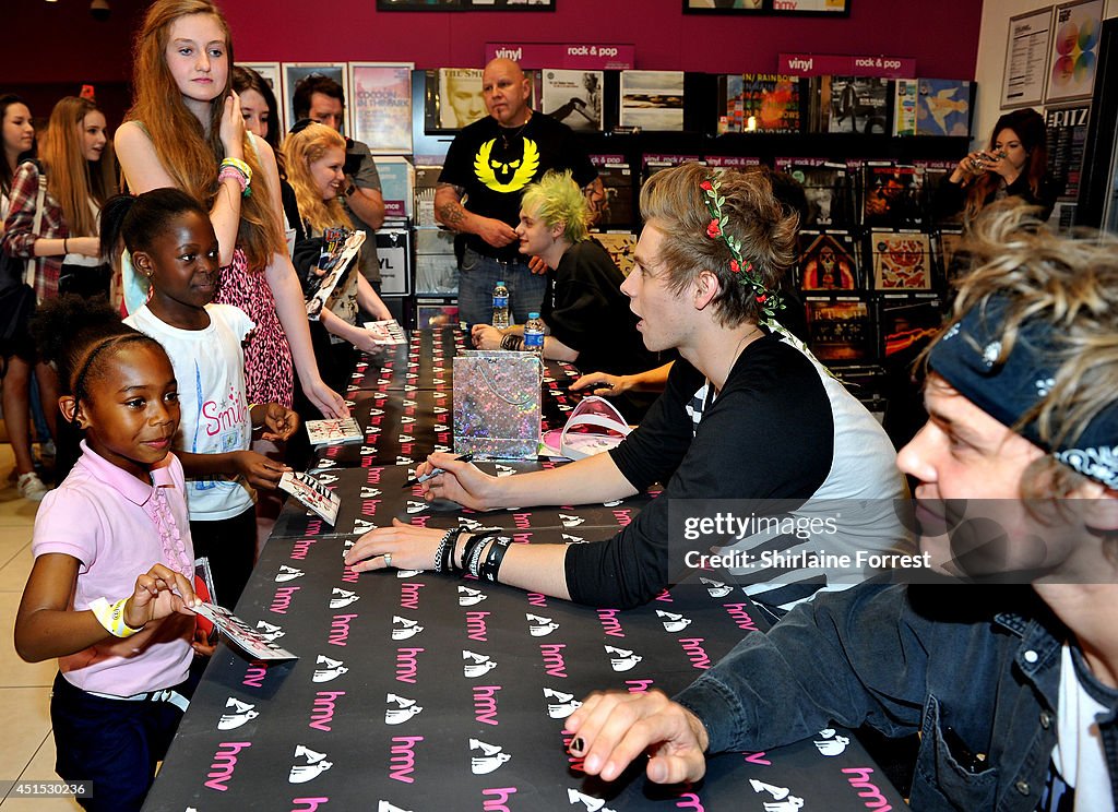 5 Seconds Of Summer Sign Copies Of Their Self Titled Debut Album