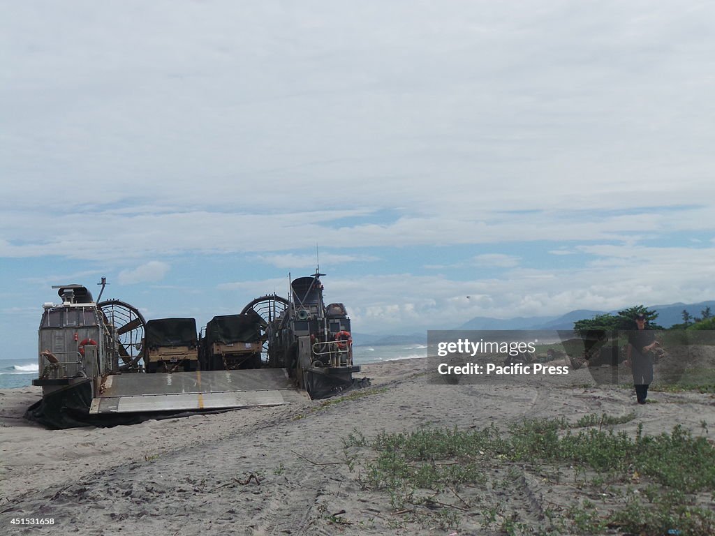 A U.S. Navy LCAC (Landing Craft Air Cushion) cruises on the...