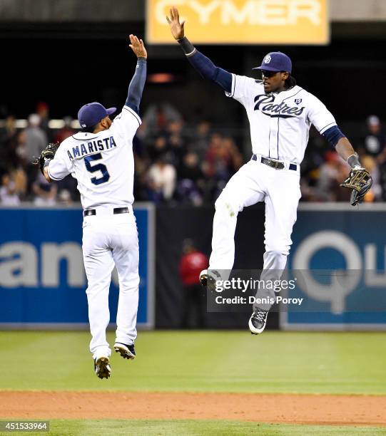 Cameron Maybin of the San Diego Padres, right, and Alexi Amarista celebrate after beating the Cincinnati Reds 1-0 in baseball game at Petco Park June...