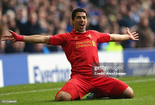 Luis Suarez of Liverpool celebrates scoring his team's second goal during the Barclays Premier League match between Everton and Liverpool at Goodison...