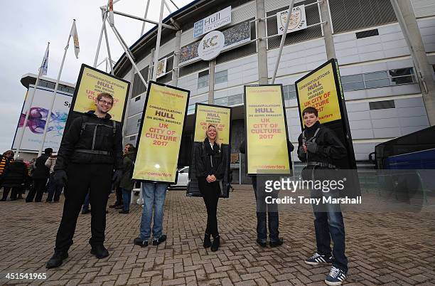 People wearing boards advertising Hull as the UK City of Culture for 2017 outside of the KC Stadium before the Barclays Premier League match between...