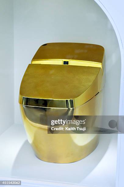 Gold toilet is displayed during the "Toilet!? Human Waste and Earth's Future" exhibition at The National Museum of Emerging Science and Innovation -...