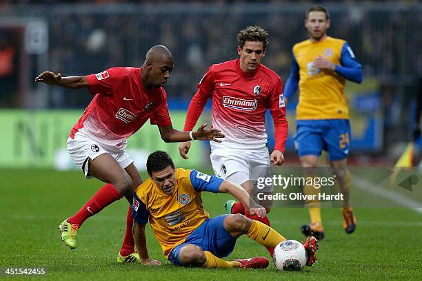 Mirko Boland of Braunschweig and Gelson Fernandes of Freiburg compete for the ball during the Bundesliga match between Eintracht Braunschweig and SC...