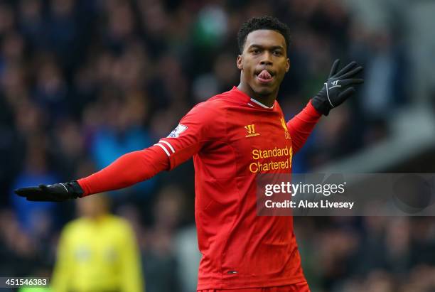 Daniel Sturridge of Liverpool celebrates scoring his team's third goal during the Barclays Premier League match between Everton and Liverpool at...