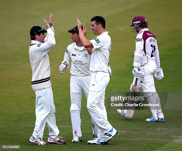Tobias Roland-Jones of Middlesex celebrates with team mates after taking the wicket of Northamptonshire's Robert Newton during day three of the LV...
