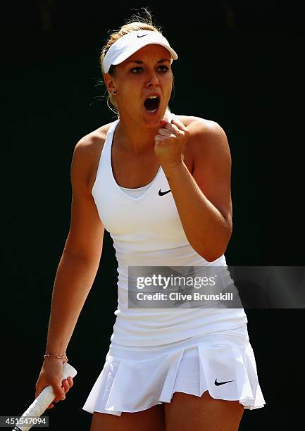 Sabine Lisicki of Germany celebrates during her Ladies' Singles fourth round match against Yaroslava Shvedova of Kazakhstan on day eight of the...