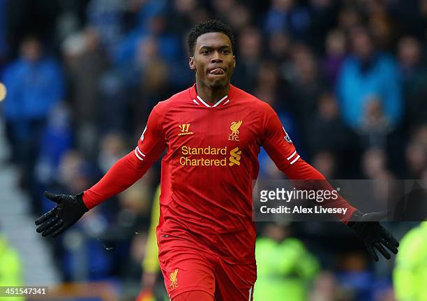 Daniel Sturridge of Liverpool celebrates scoring his team's third goal during the Barclays Premier League match between Everton and Liverpool at...