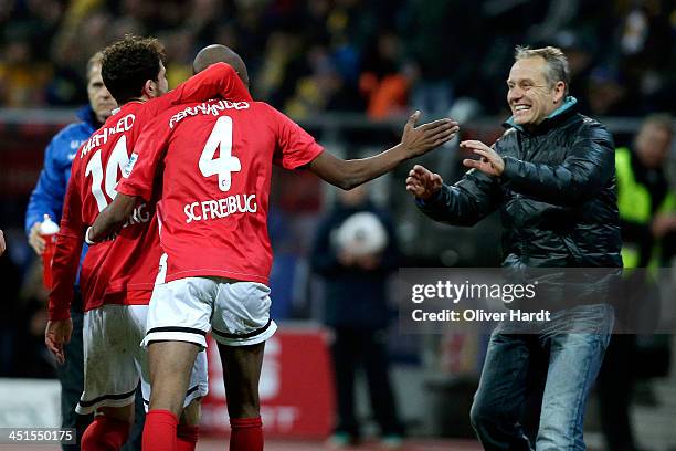 Gelson Fernandes of Freiburg celebrates after scoring their first goal with Head coach Christian Streich during the Bundesliga match between...